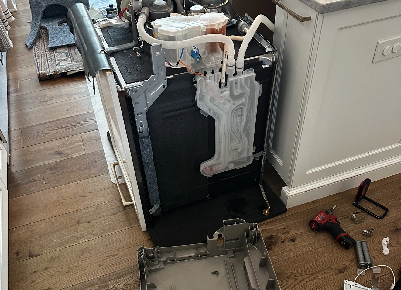 Broken Bosch dishwasher door spring mount causing the door to fall open